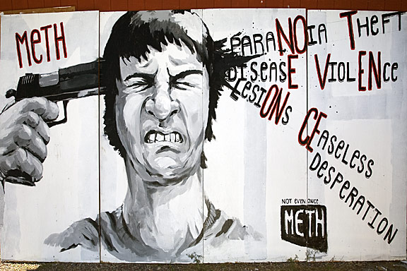 A large bill board style painting. The suicide reference reflects the self destructive properties of Meth. The words that are coming from the wound are behaviors and effects of usage. In the words I highlighted the term “Not Even Once”. I think the strong and “disturbing” painting will attract negative attention to meth use. The words also give a further description of the horrors. I painted this on plywood with house paints-taking around 10 hours to complete.
